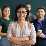 Portrait of young biracial female leader member of corporate team